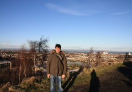 Phil with the city in the background